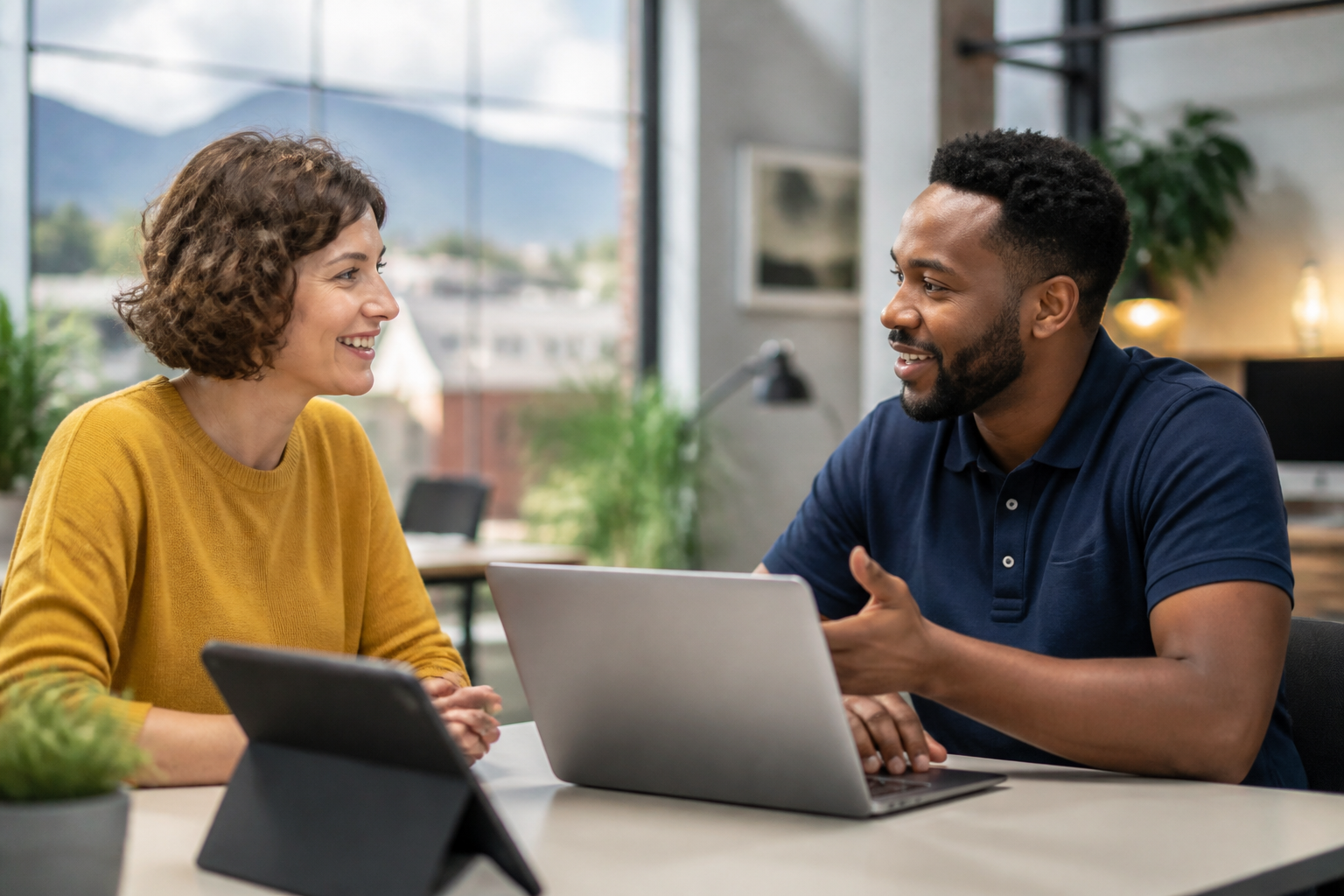 Small business owner interacting with a friendly IT support technician in Asheville